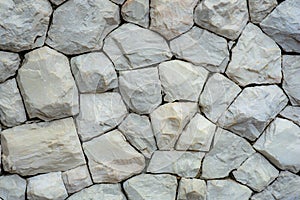 The Grunge stone wall texture are made of gray and light brown granite.