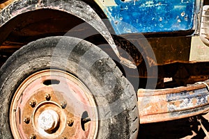 Grunge style shot of outworn and deteriorated front tyre of an old truck