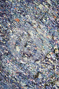 Stone surface stained with motley paint spots