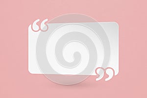 White paper cut quote background with quotation marks on grunge pink paper useful for customer reviews and product photo