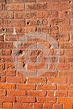 Grungy Brick Wall With Carvings