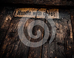 Grungy Handle With Care Sign