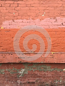 Grungy industrial urban painted red brick wall