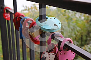 Grungy metal love padlocks with heart decoration. Traditional heart-shaped lock as a symbol of eternal love