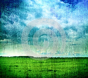 Grungy nature backdrop - grass and cloudy sky