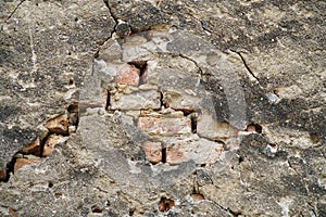 Grungy old red brick wall texture background with deterioration from age