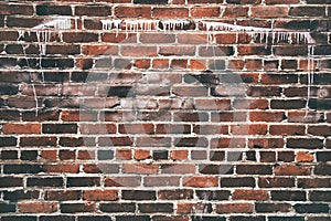 Grungy old red brick wall texture background with deterioration from age