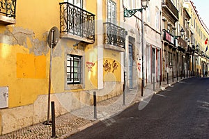 Grungy old town street Barrio Alto, Lisbon, Portugal photo