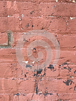 Grungy red brick wall close up with paint splashes