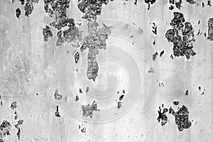 Grungy rusted metal wall surface in black and white