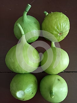 Grup of Ripe figs on a brown background