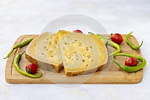 Gruyere cheese on wood background.