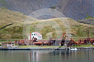 Grytviken rusty steel tanks of abandoned whaling station in South Georgia. Lost places with rusty tanks, old boats, Antarctica.
