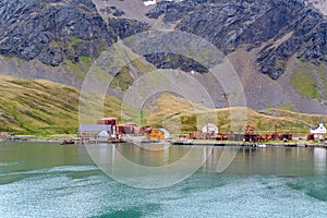 Grytviken shipwrecks and rusty of abandoned whaling station in South Georgia. Lost places with rusty tanks, old boats, Antarctica.