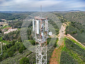 GSM, 4G, 5G and radio telecommunication towers on the top of a mountain. Cell phone tower and transceiver