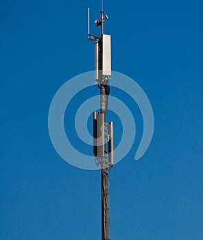 A GSM antenna on a sky blue background