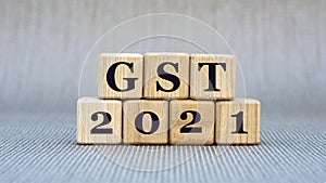 GST 2021 - word on wooden cubes on a gray background