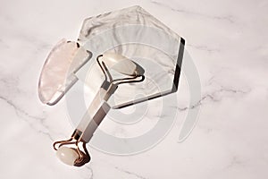 Gua sha face roller for massage. Lifting and toning treatment at home.