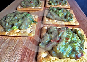 Guacamole on crackers photo
