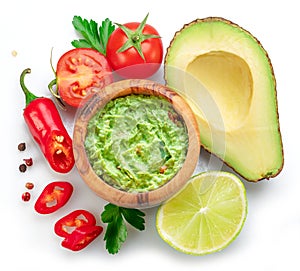 Guacamole and guacamole ingredients isolated on white background. Flat lay