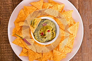 Guacamole and nacho chips.