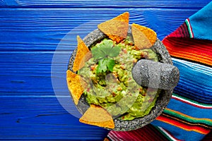 Guacamole with nachos in Mexican molcajete
