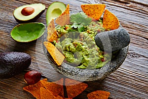 Guacamole with nachos in Mexican molcajete photo