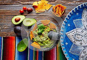 Guacamole with nachos in Mexican molcajete photo