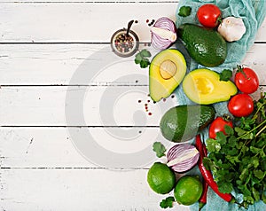 Guacamole sauce ingredients - avocado, tomato, onion, pepper chili, garlic, cilantro, lime