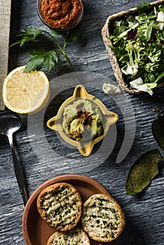 Guacamole and vegan sobrasada on a table