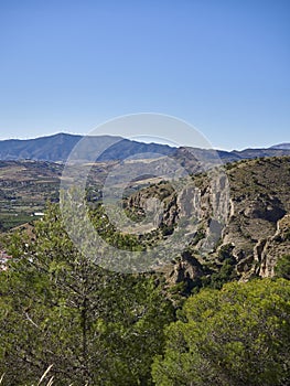 A view of the Guadalhorce Valley from the footpath on the Sendero el Santo route within the mountains of Andalucia. photo