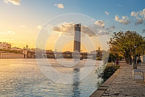 Guadalquivir River and Sevilla Tower (Torre Sevilla) at Sunset - Seville, Spain