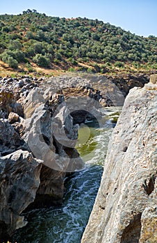 Guadiana river flows through the deep gully in schists. Pulo do Lobo. Alentejo. Portugal