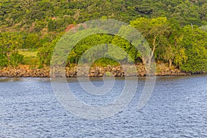 Guaiba lake with rocks and trees photo