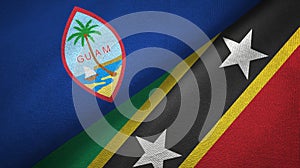 Guam and Saint Kitts and Nevis two flags textile cloth, fabric texture