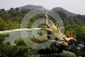 Guan Yin - Bodhisattva/ Goddess of Compassion riding on dragon photo