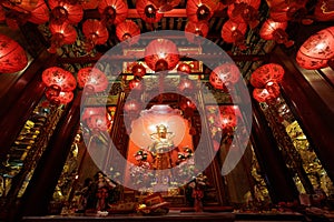 Guan Yin shrine and red Chinese lanterns