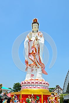 Guan Yin statue on blue sky background