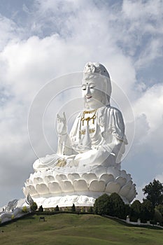 Guan yin statue on the peak hill at the temple in Thailand