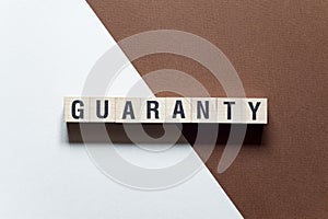 Guaranty - word concept on cubes