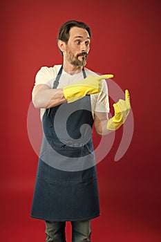 On guard of cleanliness and order. Cleaning service and household duty. Lot of work. Gardening concept. Man in apron