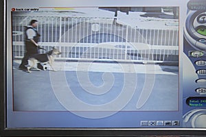 Guard With Dog Seen On Picture From Security Camera