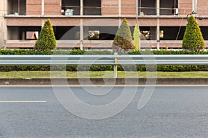 The guard rail, barrier on wayside with cloudy and hill. the straight line from highway fence. image from background, highway fenc