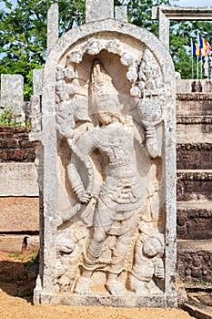 Guard stone in Thuparama temple entrance, naga raja and two dwarfs carved in one stone