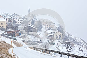 Guarda village at snowfall, Lower Engadine, Graubunden; Switzerland photo