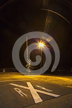Guarded level crossing at night in Kingman