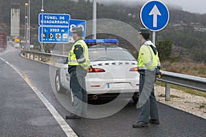 Guardia Civil officers watch traffic photo