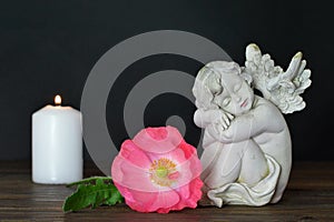 Guardian angel, flower and candle