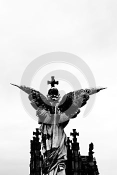 Guardian angel protecting the crosses photo