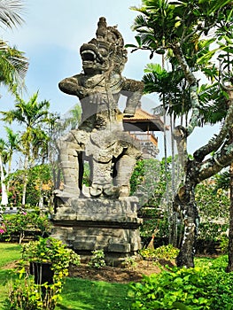 A guardian figure at a balinese hindu temple on Bali island in Indonesia